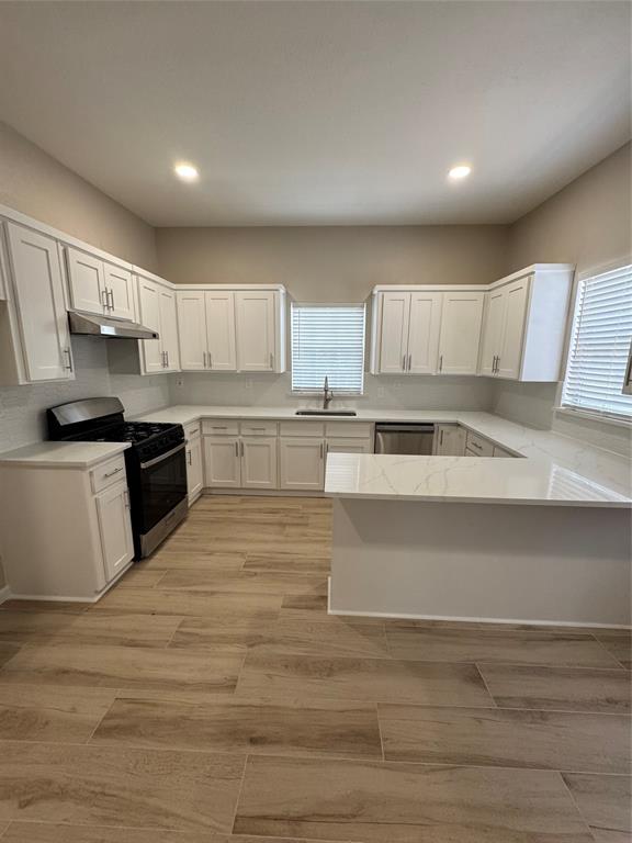 306 North College Street Howe, TX 75459 - Photo 3 of 15 a view of kitchen with wooden floor