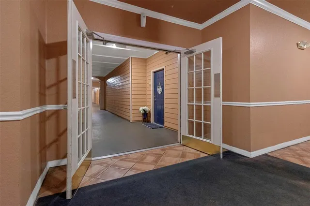 a living room with furniture a window and a flat screen tv