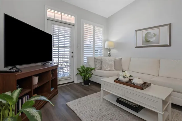 a view of a roof deck with chair and wooden floor