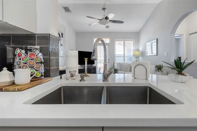 a bathroom with a toilet a sink a mirror a bathtub and vanity