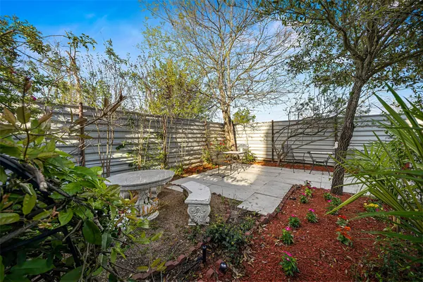 a view of a swimming pool with an outdoor seating