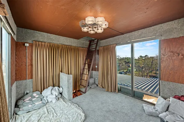 a view of a balcony with wooden floor and city view