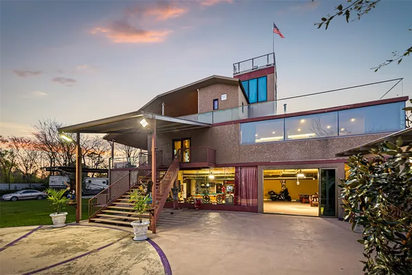 a view of a building with car parked
