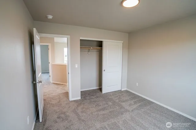 an empty room with a bathroom