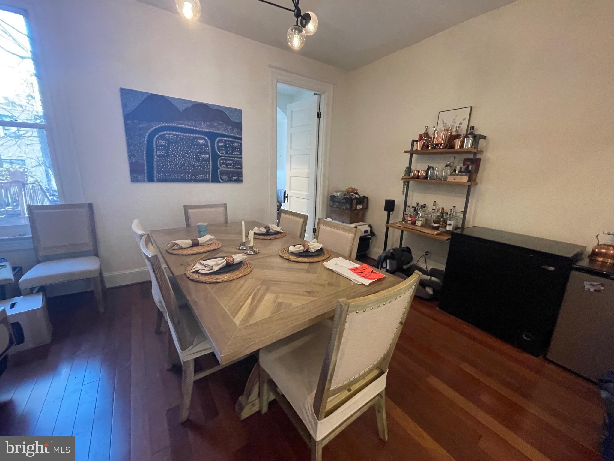 1750 T Street Northwest, Unit B Washington, DC 20009 - Photo 3 of 14 a view of a dining room with furniture and wooden floor