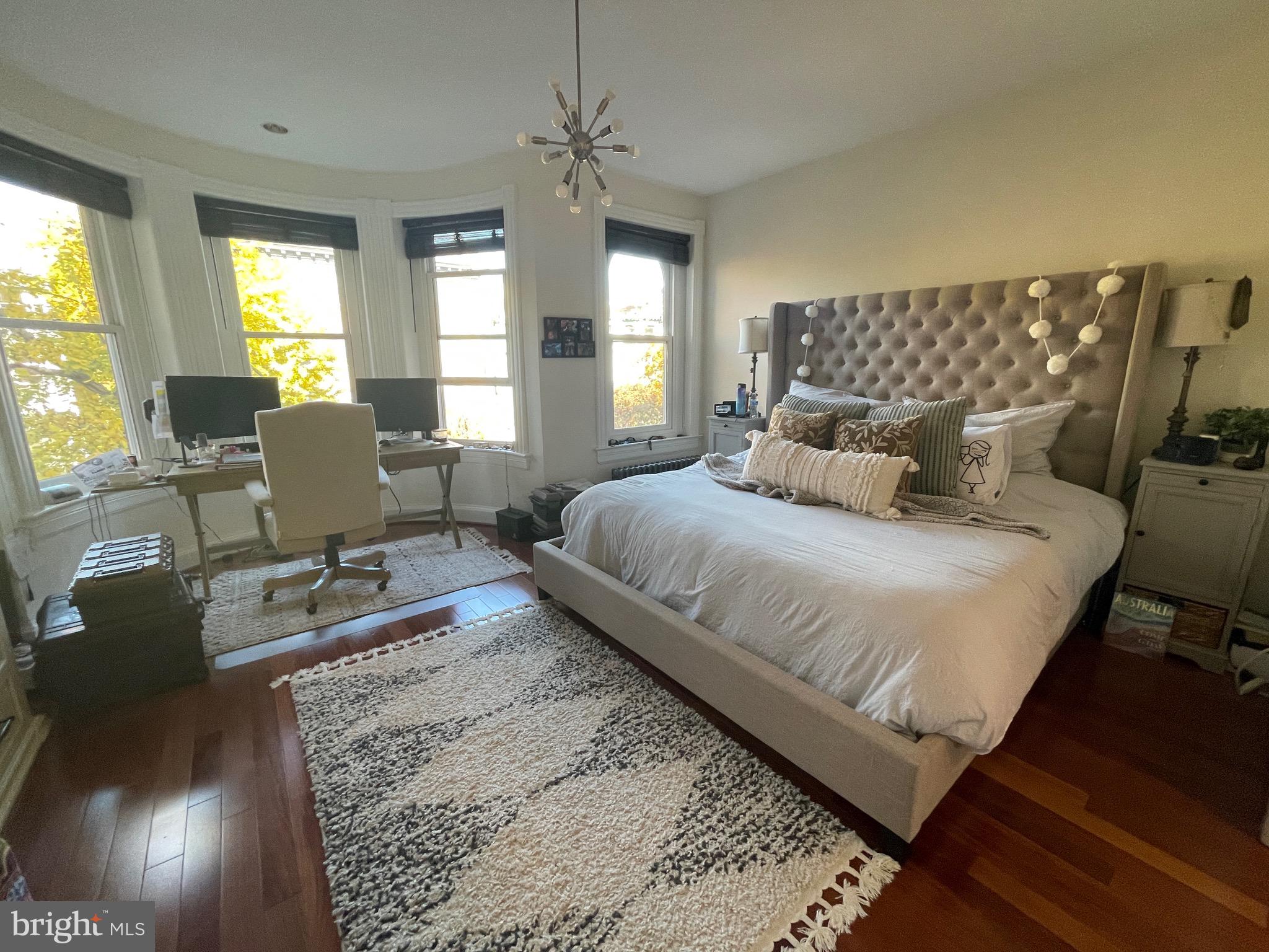 1750 T Street Northwest, Unit B Washington, DC 20009 - Photo 6 of 14 a bedroom with a bed window and couch