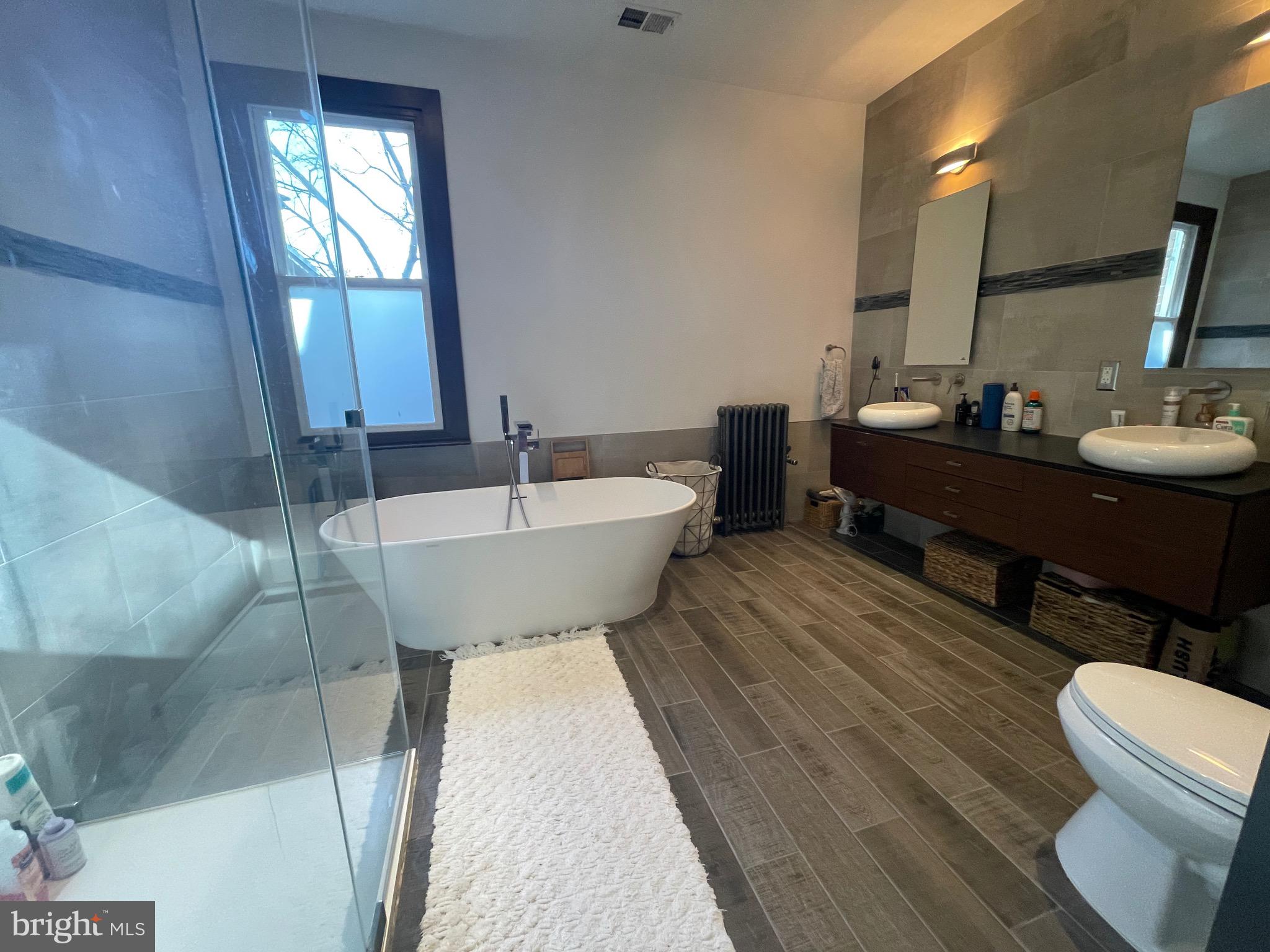 1750 T Street Northwest, Unit B Washington, DC 20009 - Photo 8 of 14 a bathroom with a sink mirror toilet and bathtub