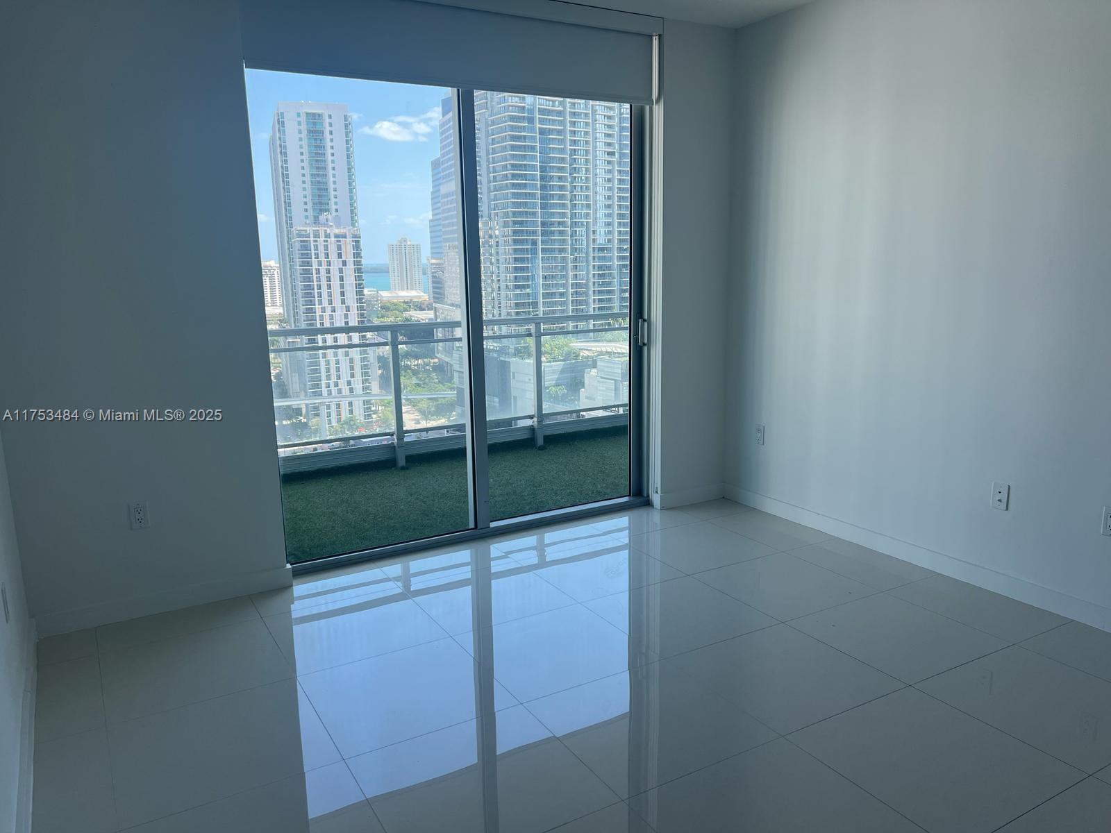 92 Southwest 3rd Street, Unit 2412 Miami, FL 33130 - Photo 8 of 14 a view of an empty room with a window