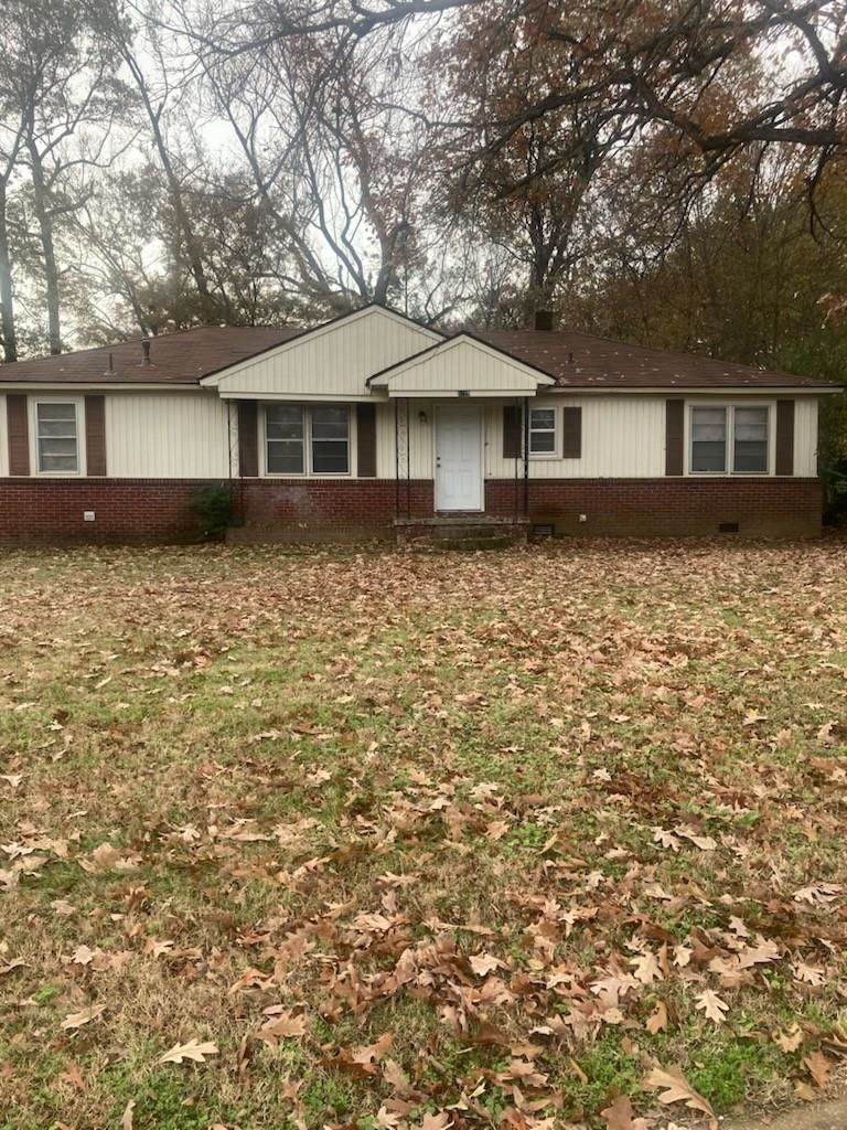 6729 Macon Road Memphis, TN 38134 - Photo 1 of 16 a front view of a house with yard