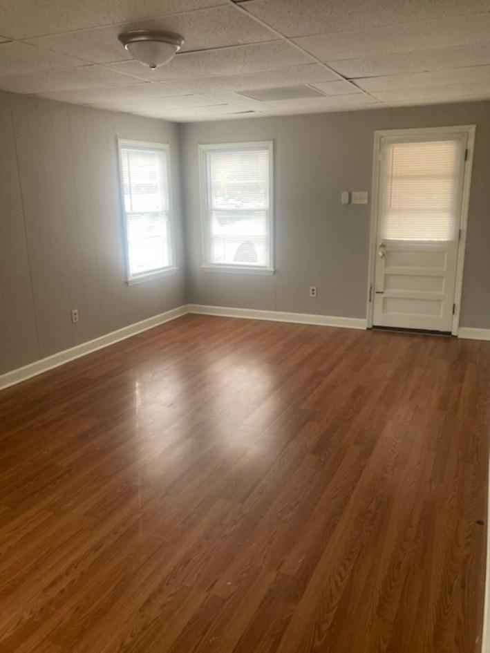 6729 Macon Road Memphis, TN 38134 - Photo 13 of 16 an empty room with wooden floor and windows