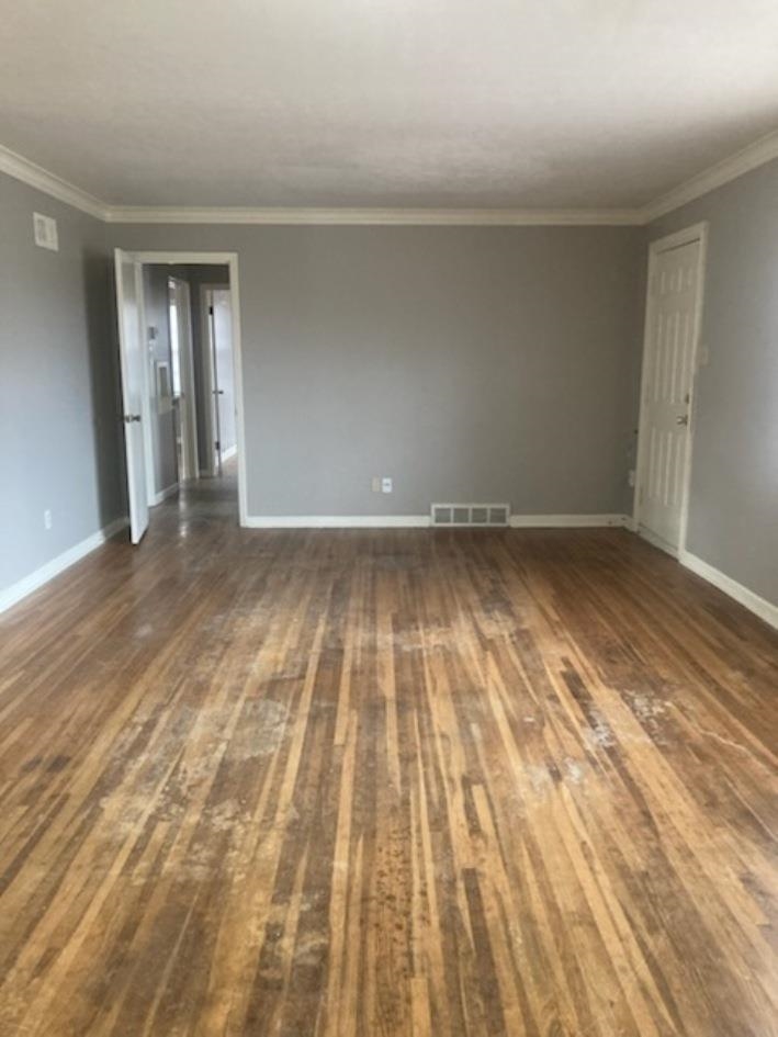 6729 Macon Road Memphis, TN 38134 - Photo 3 of 16 a view of an empty room and wooden floor