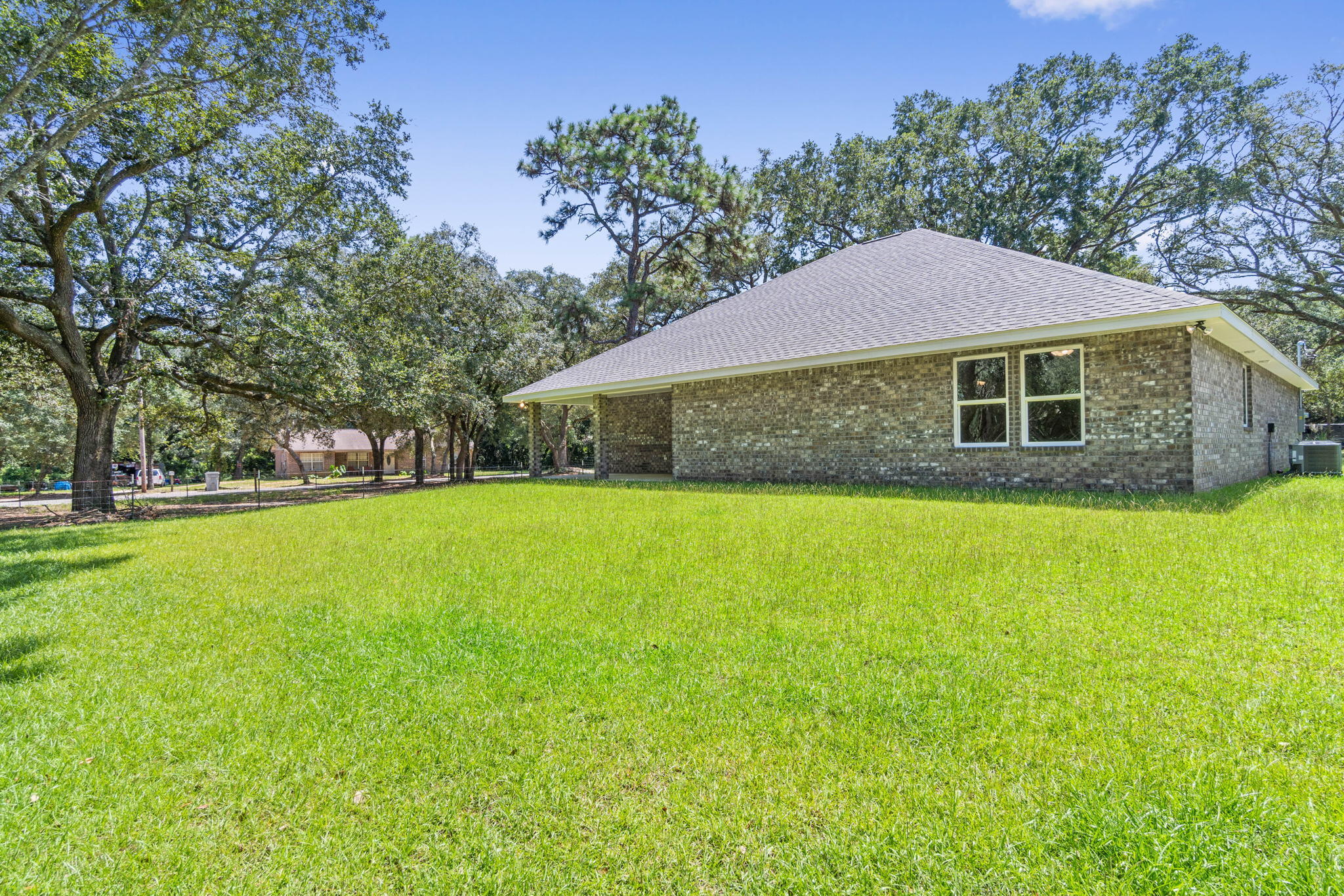 9224 Trident Road Milton, FL 32583 - Photo 44 of 47 a front view of house with yard and green space