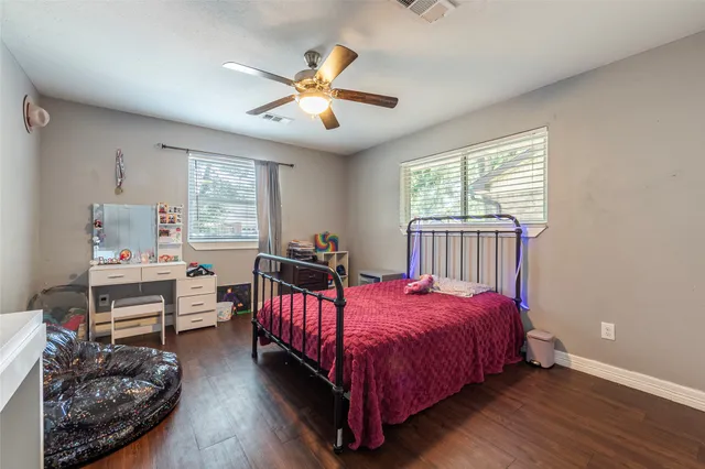 a bed room with a bed and a window