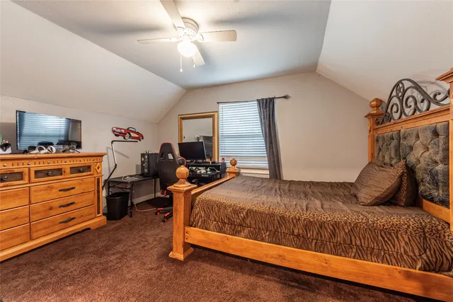 a bedroom with a bed and furniture