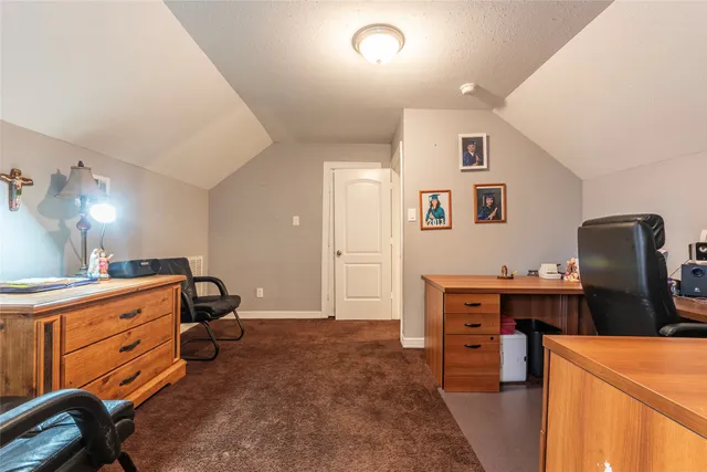 a view of a workspace with furniture