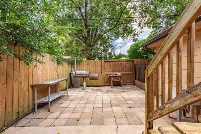 a view of backyard with outdoor seating