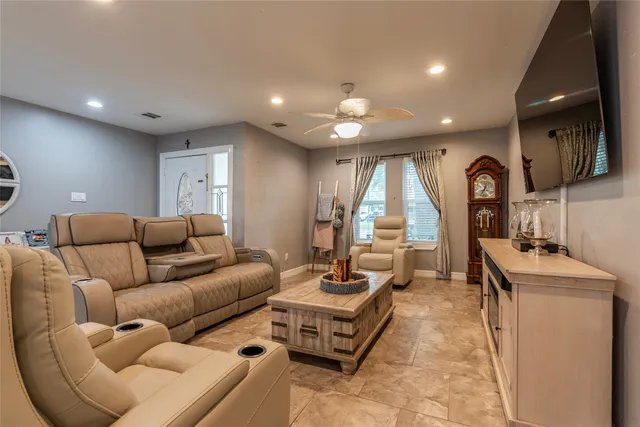 a living room with furniture and a large window