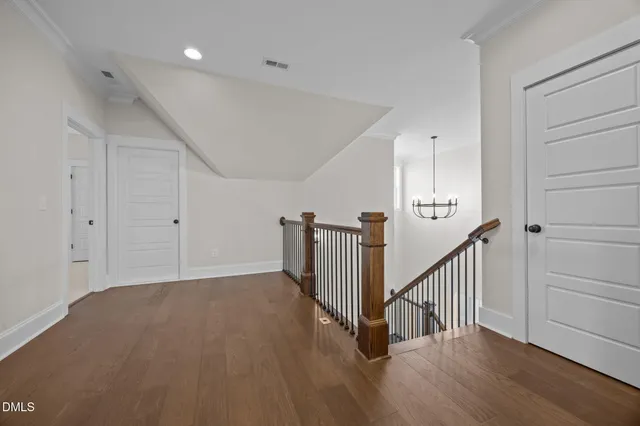 a bathroom with a granite countertop sink a toilet and with mirror