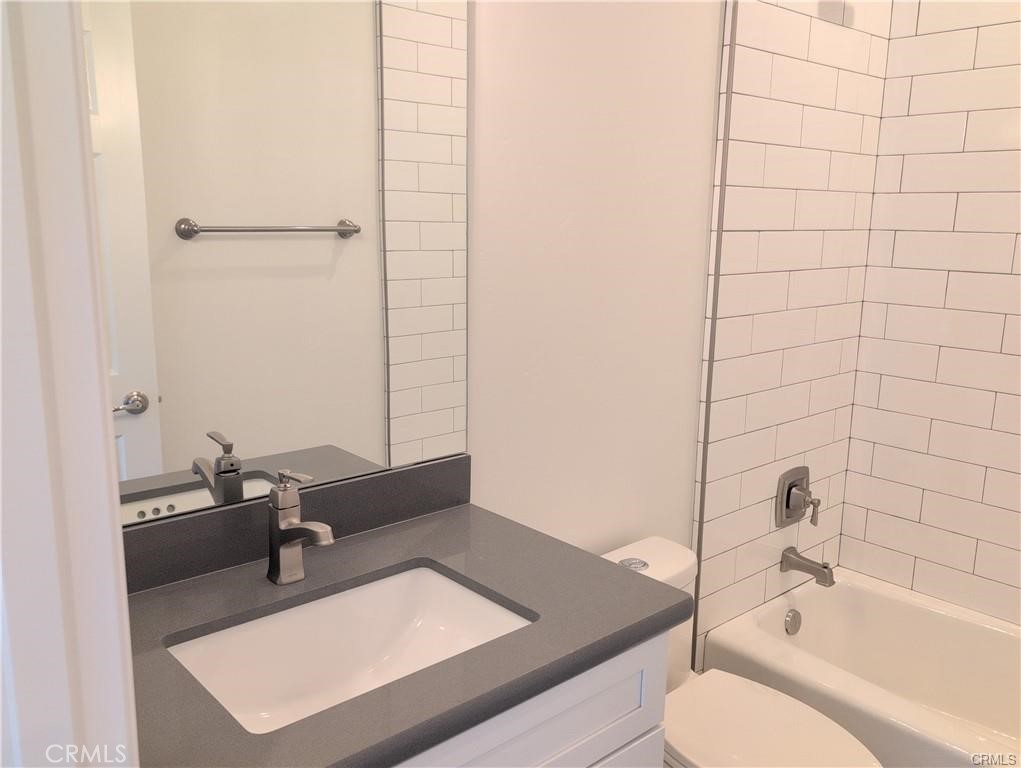 1452 Ronald Way Oceano, CA 93445 - Photo 8 of 11 a bathroom with a tub sink vanity and toilet