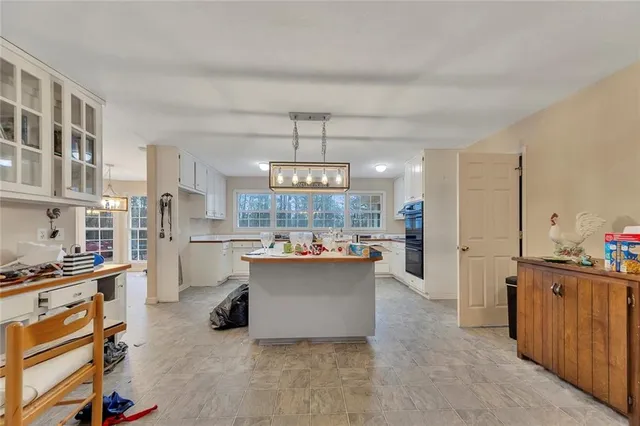 a kitchen with stainless steel appliances a stove a sink dishwasher and cabinets