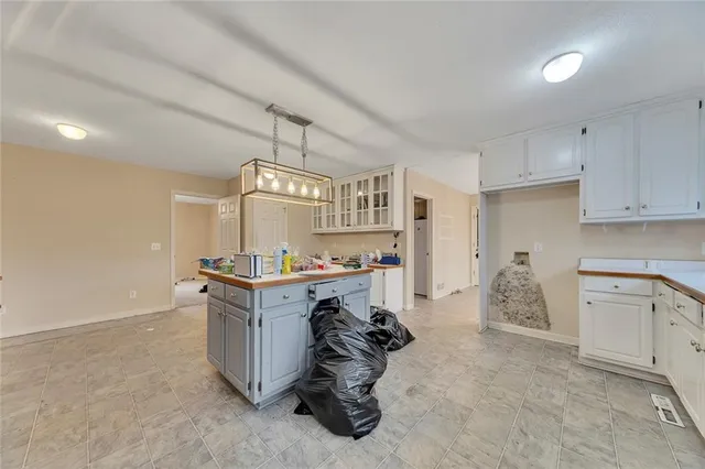 a kitchen with a stove and a refrigerator