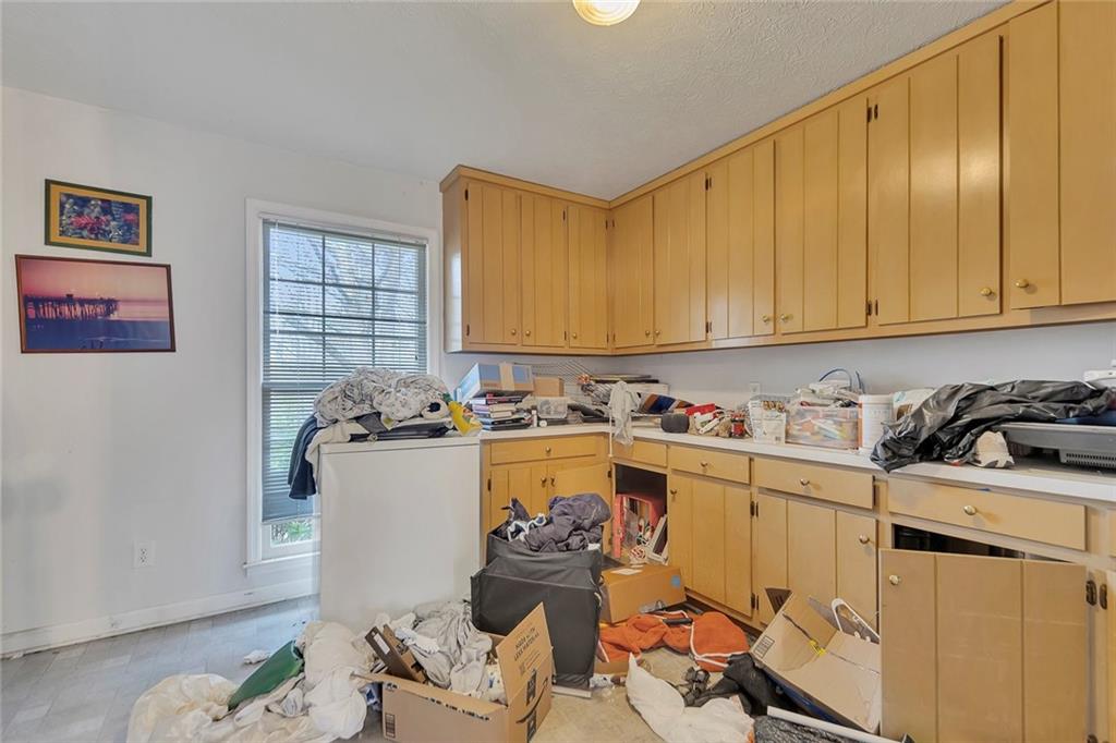 259 Holley Heights Jasper, GA 30143 - Photo 23 of 53 a kitchen with a sink and cabinets