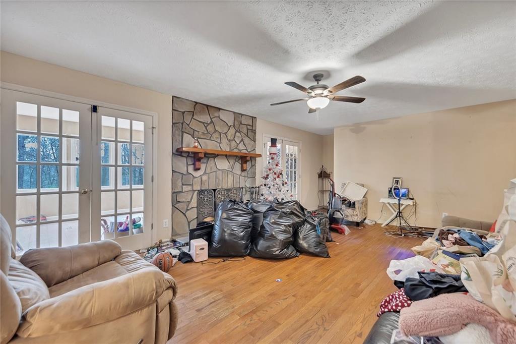 259 Holley Heights Jasper, GA 30143 - Photo 24 of 53 a bed room with a bed and a couch