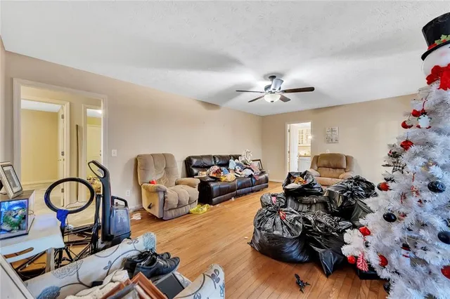 a living room with furniture a chandelier and a chandelier