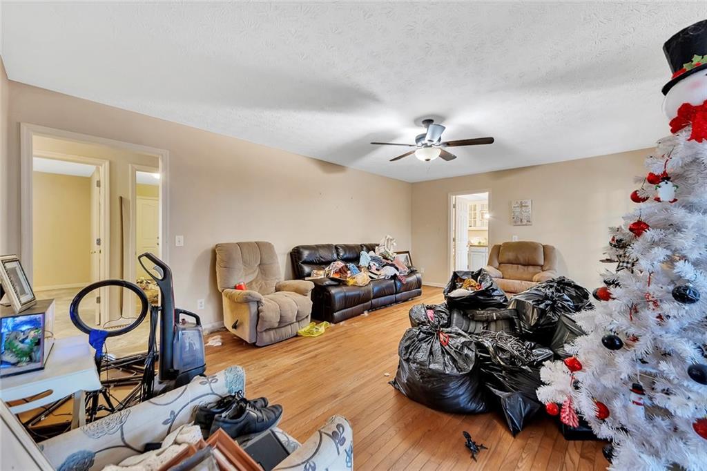 259 Holley Heights Jasper, GA 30143 - Photo 25 of 53 a living room with furniture a chandelier and a chandelier