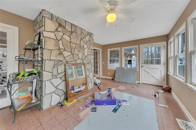 a living room with furniture and next to a window