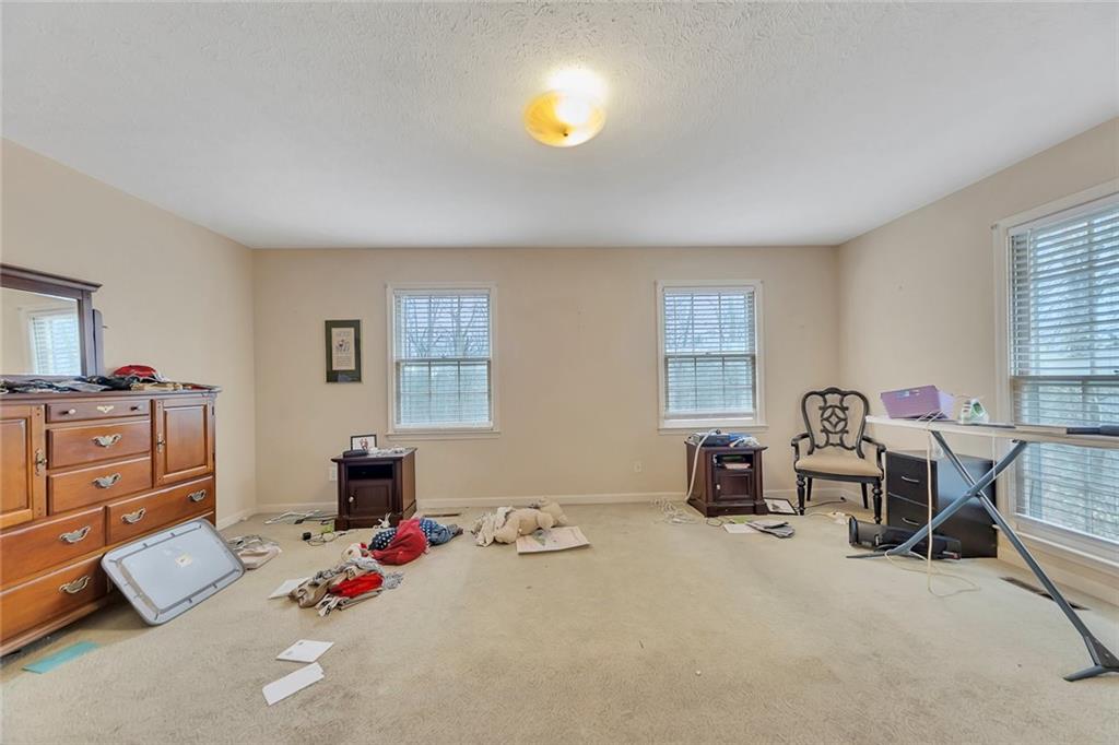 259 Holley Heights Jasper, GA 30143 - Photo 28 of 53 a bedroom with furniture and a window
