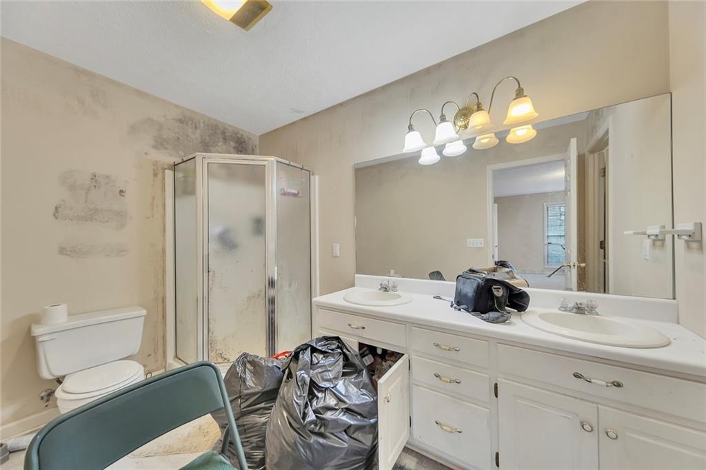 259 Holley Heights Jasper, GA 30143 - Photo 30 of 53 a bathroom with a sink double vanity and a mirror