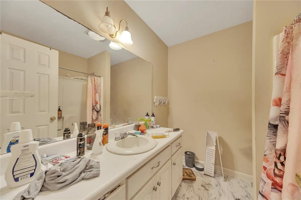 259 Holley Heights Jasper, GA 30143 - Photo 34 of 53 a bathroom with a sink and a mirror