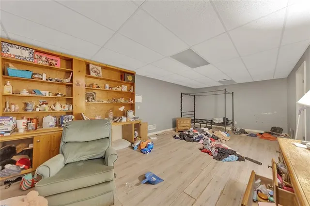 a bed room with a bed window and a table