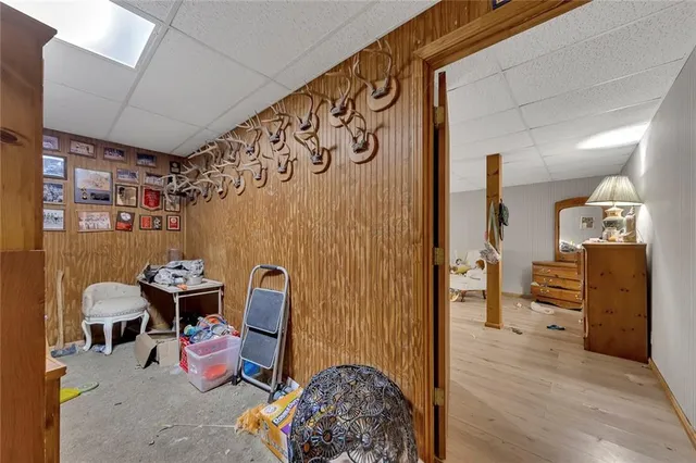 a bedroom with furniture and wooden floor