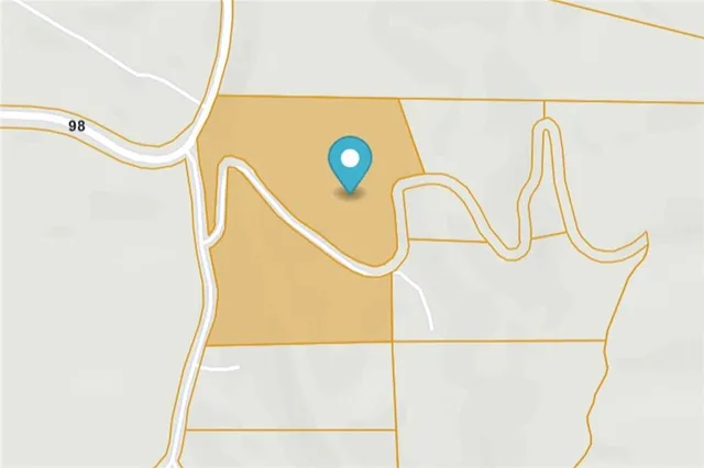 a backyard of a house with lots of green space and trees