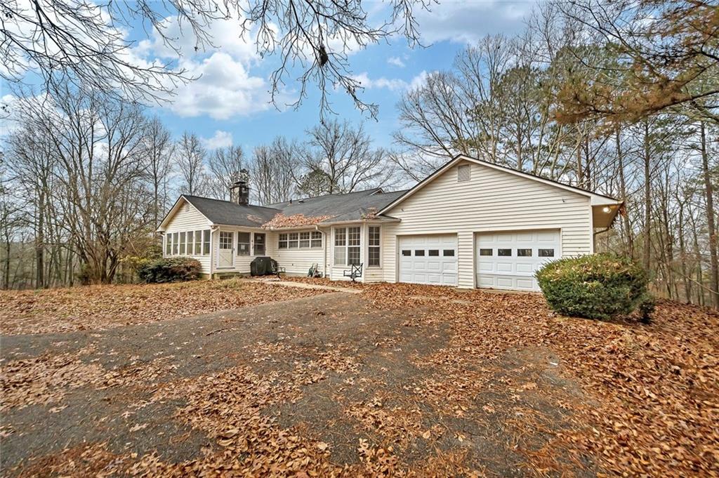 259 Holley Heights Jasper, GA 30143 - Photo 5 of 53 a front view of a house with a yard and garage