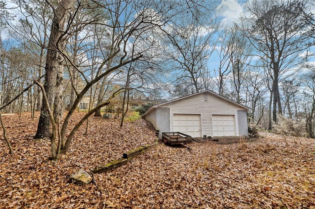 259 Holley Heights Jasper, GA 30143 - Photo 8 of 53 a white house that has a tree in front of it