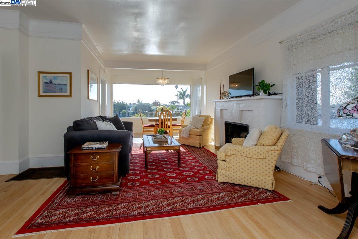 2000 Clinton Avenue Alameda, CA 94501 - Photo 11 of 57 a living room with furniture and a fireplace