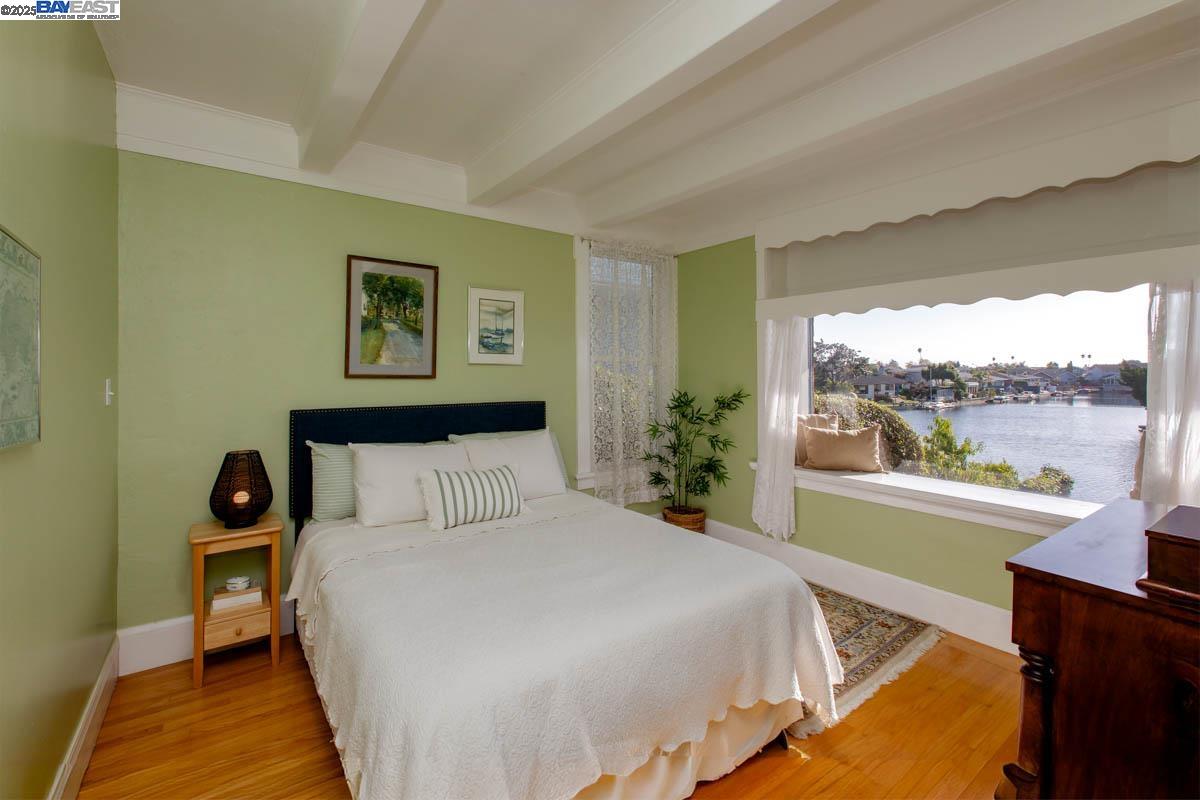 2000 Clinton Avenue Alameda, CA 94501 - Photo 23 of 57 a bedroom with a large bed and a large window with outer view