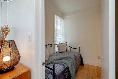 a bedroom with furniture and a window