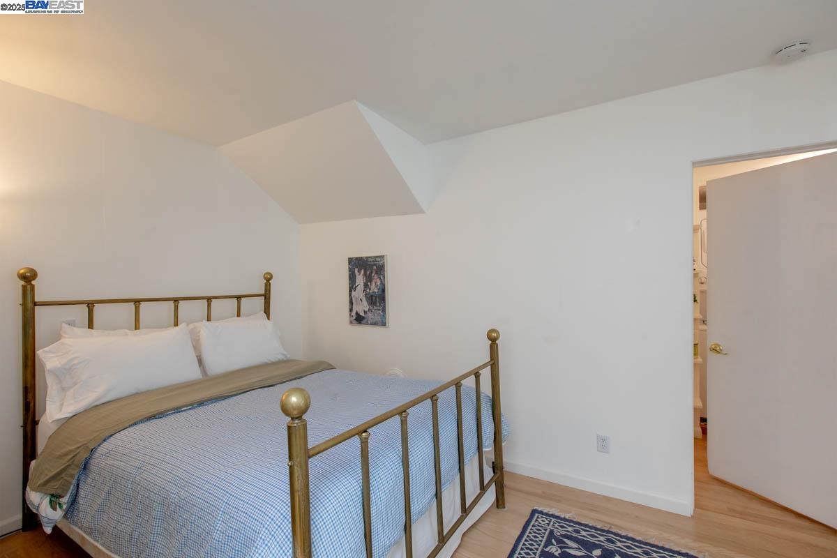 2000 Clinton Avenue Alameda, CA 94501 - Photo 27 of 57 a view of a bedroom with wooden floor