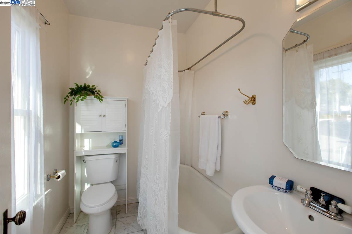 2000 Clinton Avenue Alameda, CA 94501 - Photo 31 of 57 a bathroom with a sink toilet and shower