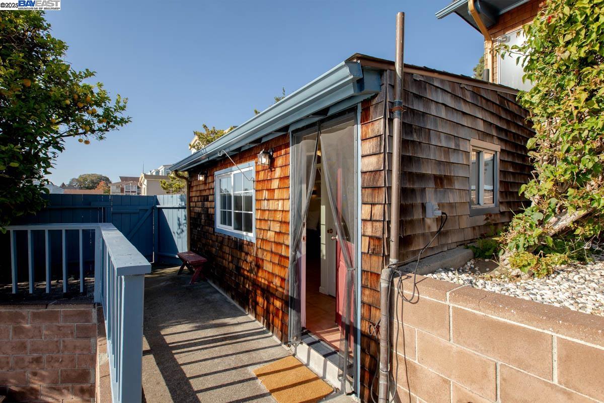 2000 Clinton Avenue Alameda, CA 94501 - Photo 44 of 57 a view of balcony with wooden floor and fence and a potted plant