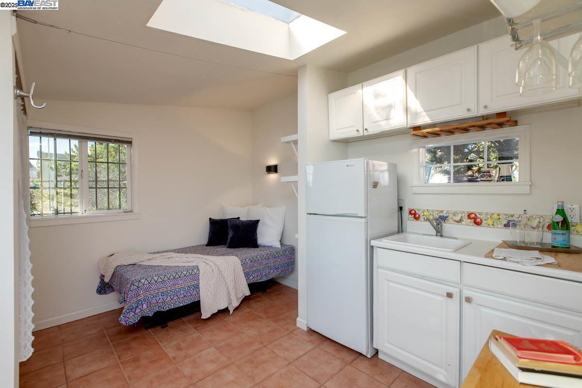 2000 Clinton Avenue Alameda, CA 94501 - Photo 45 of 57 a bedroom with a bed and a window