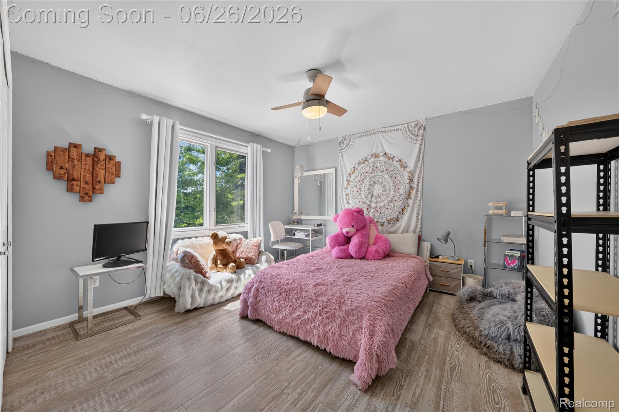 2619 Lambeth Park Rochester, MI 48306 - Photo 41 of 71 Room with wood-finish flooring, a ceiling fan, and a large window