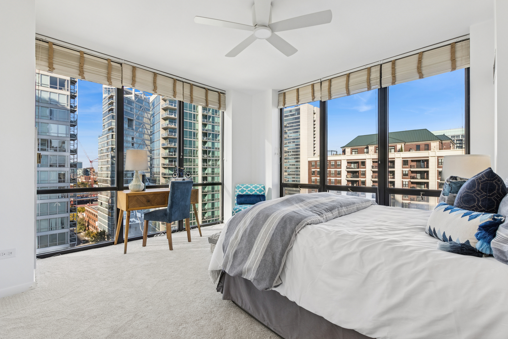 435 West Erie Street, Unit 1408 Chicago, IL 60654 - Photo 8 of 22 a large bedroom with a large bed and a balcony view