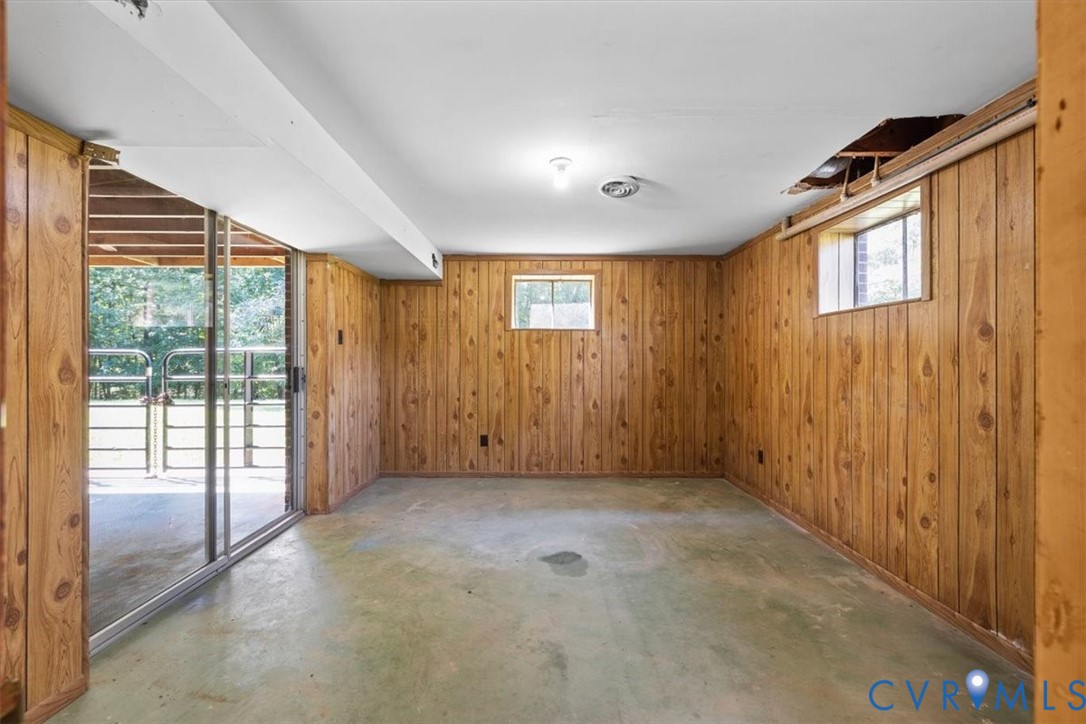 3577 Old Buckingham Road Powhatan, VA 23139 - Photo 31 of 36 Wood-paneled room featuring a sliding glass door,