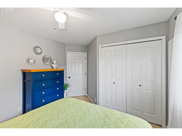 a bedroom with a bed and a dresser