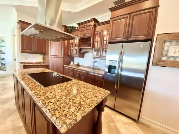 a living room with furniture a flat screen tv and a large window